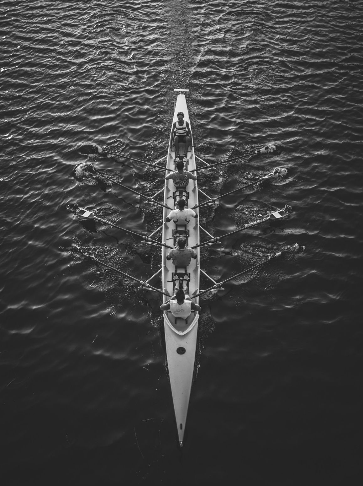 people riding boat on body of water